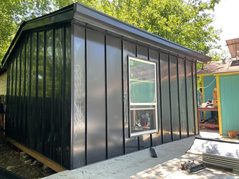 Black standing seam metal wall panels for Roof Inspection in Alamosa