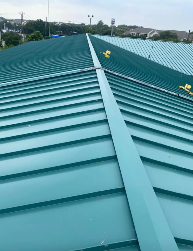 Green commercial metal roof ridge and valley for Metal Roof Repair in Alamosa